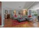 Spacious living area with sectional sofa and hardwood floors at 1957 Temple Ter, Clearwater, FL 33764