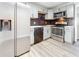 Modern kitchen with stainless steel appliances and gray cabinets at 2557 17Th S Ave, St Petersburg, FL 33712