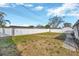 Large backyard with grassy area, privacy fence, and patio at 6598 26Th N St, St Petersburg, FL 33702