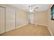 Well-lit bedroom with double door closet and wood-look floors at 6598 26Th N St, St Petersburg, FL 33702