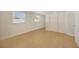 Bright bedroom with wood-look floors and double door closet at 6598 26Th N St, St Petersburg, FL 33702