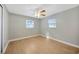 Spacious bedroom with ceiling fan and light wood-look floors at 6598 26Th N St, St Petersburg, FL 33702