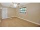 Bedroom with ceiling fan and wood-look floors at 6598 26Th N St, St Petersburg, FL 33702