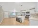 Open concept kitchen and living area with island and stainless steel appliances at 6598 26Th N St, St Petersburg, FL 33702