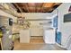 Basement laundry room with washer, dryer, and storage shelves at 6598 26Th N St, St Petersburg, FL 33702