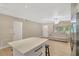 Living room with light gray reclining sofas and light wood flooring at 6598 26Th N St, St Petersburg, FL 33702