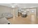 Living room with gray reclining sofas and ceiling fan at 6598 26Th N St, St Petersburg, FL 33702