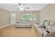 Living room with two large reclining sofas and wood floors at 6598 26Th N St, St Petersburg, FL 33702