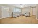 Living room with gray sofas, wood flooring and entryway at 6598 26Th N St, St Petersburg, FL 33702