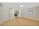 Spare bedroom with wood flooring and access to kitchen at 6598 26Th N St, St Petersburg, FL 33702