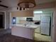 Kitchen boasts an island and microwave at 2095 59Th N St, Clearwater, FL 33760