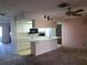 Kitchen with island and white cabinetry at 2095 59Th N St, Clearwater, FL 33760