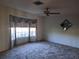 Bright living room featuring bay window and ceiling fan at 2095 59Th N St, Clearwater, FL 33760