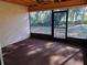 Spacious screened porch overlooking a backyard at 2095 59Th N St, Clearwater, FL 33760