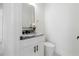 Modern bathroom with gray countertop vanity and black accents at 2513 W Hiawatha St, Tampa, FL 33614