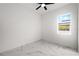 Bright bedroom with ceiling fan and marble-look flooring at 2513 W Hiawatha St, Tampa, FL 33614