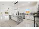 Modern kitchen with island, white cabinets, and gray countertops at 2513 W Hiawatha St, Tampa, FL 33614