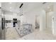 Modern kitchen with white cabinets, marble countertops, and island at 2513 W Hiawatha St, Tampa, FL 33614