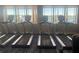 Gym treadmills with beautiful lake view for working out with nature at your side in the community center at 5011 Sandy Brook Cir, Wimauma, FL 33598