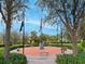 Outdoor memorial with flags, benches, and manicured landscaping at 5011 Sandy Brook Cir, Wimauma, FL 33598