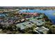 Aerial view of multiple tennis courts and bocce ball lanes in a well-maintained community at 5011 Sandy Brook Cir, Wimauma, FL 33598