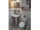 Bathroom with white tile, toilet, sink and vanity at 5809 23Rd S Ave, Gulfport, FL 33707