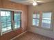 Bedroom with wood-paneled walls and large windows at 5809 23Rd S Ave, Gulfport, FL 33707