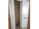 Small closet with wood shelving and hanging rod at 5809 23Rd S Ave, Gulfport, FL 33707