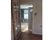 Hallway with view into a room with wood paneled walls at 5809 23Rd S Ave, Gulfport, FL 33707