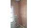 Laundry area with wood paneled walls and window at 5809 23Rd S Ave, Gulfport, FL 33707