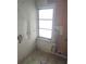 Laundry area with wood paneled walls and window at 5809 23Rd S Ave, Gulfport, FL 33707