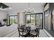 Bright dining room with sliding doors leading to the pool at 6054 Sawgrass Lake Ct, Nokomis, FL 34275