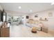 Relaxing living room featuring hardwood floors and bright natural light at 1753 Belleair Forest Dr # E2, Belleair, FL 33756