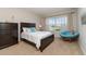 Bedroom with a queen-size bed and large window at 4284 Expedition Way, Osprey, FL 34229