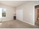 Bright bedroom with window, carpet, and double door closet at 4284 Expedition Way, Osprey, FL 34229