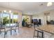 Bright dining area with glass table and chairs, overlooking balcony at 4284 Expedition Way, Osprey, FL 34229