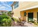 Townhome entry with green door and pathway at 4284 Expedition Way, Osprey, FL 34229