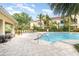 Community pool with lounge chairs and patio area at 4284 Expedition Way, Osprey, FL 34229