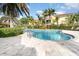 Inviting kidney-shaped pool with a tiled deck at 4284 Expedition Way, Osprey, FL 34229