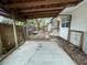 Backyard with wooden deck and covered patio at 432 2Nd Ne Ave, Largo, FL 33770