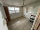 Bedroom with tiled floor, window, and wall shelving at 432 2Nd Ne Ave, Largo, FL 33770