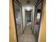 Long hallway with tiled floor and access to other rooms at 432 2Nd Ne Ave, Largo, FL 33770