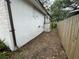 Side of the house with a wooden fence and yard at 432 2Nd Ne Ave, Largo, FL 33770