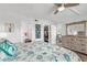 Main bedroom with walk-in closet and light wood furniture at 9815 Harrell Ave # 301, Treasure Island, FL 33706