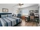 Bedroom with a queen-size bed and workspace at 9815 Harrell Ave # 301, Treasure Island, FL 33706