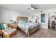 Main bedroom with light wood furniture and ocean-themed bedding at 9815 Harrell Ave # 301, Treasure Island, FL 33706