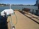 Close-up of dock featuring a wash station and hose at 9815 Harrell Ave # 301, Treasure Island, FL 33706