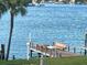 Private dock with seating, perfect for enjoying waterfront living at 9815 Harrell Ave # 301, Treasure Island, FL 33706