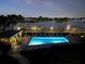 Night view of resort-style pool with waterfront view at 9815 Harrell Ave # 301, Treasure Island, FL 33706