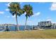 Scenic waterfront view with palm trees and boat slips at 9815 Harrell Ave # 301, Treasure Island, FL 33706